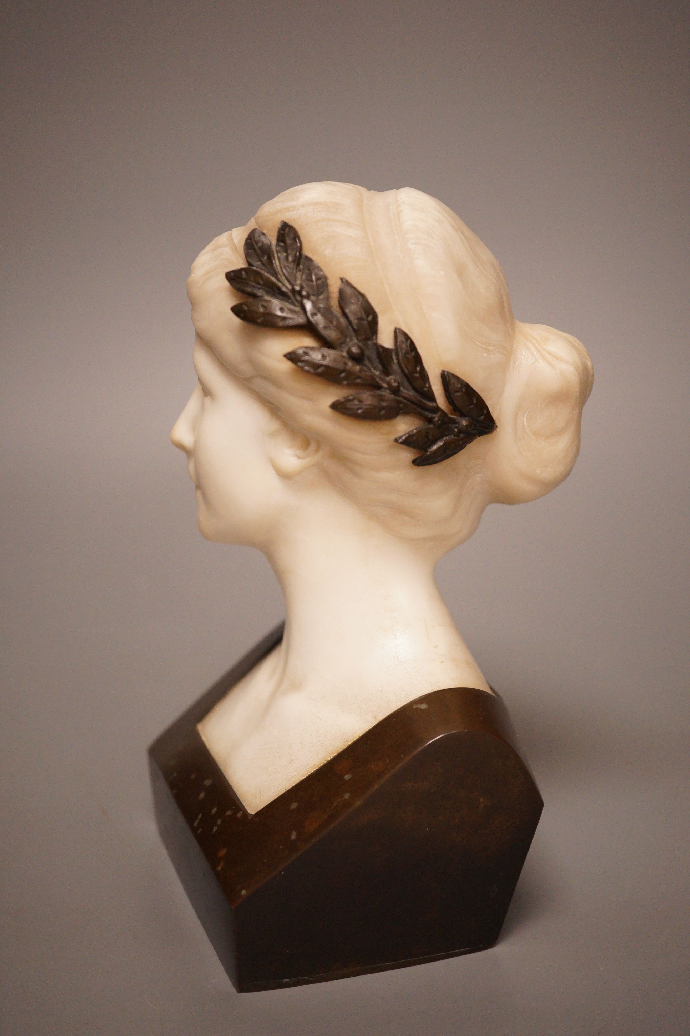 A late 19th/early 20th century French bronze and alabaster bust of a lady, 19cm